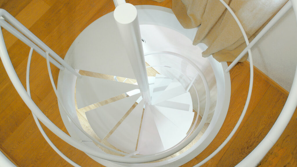 First example of a space saving metal spiral staircase: Vitre   