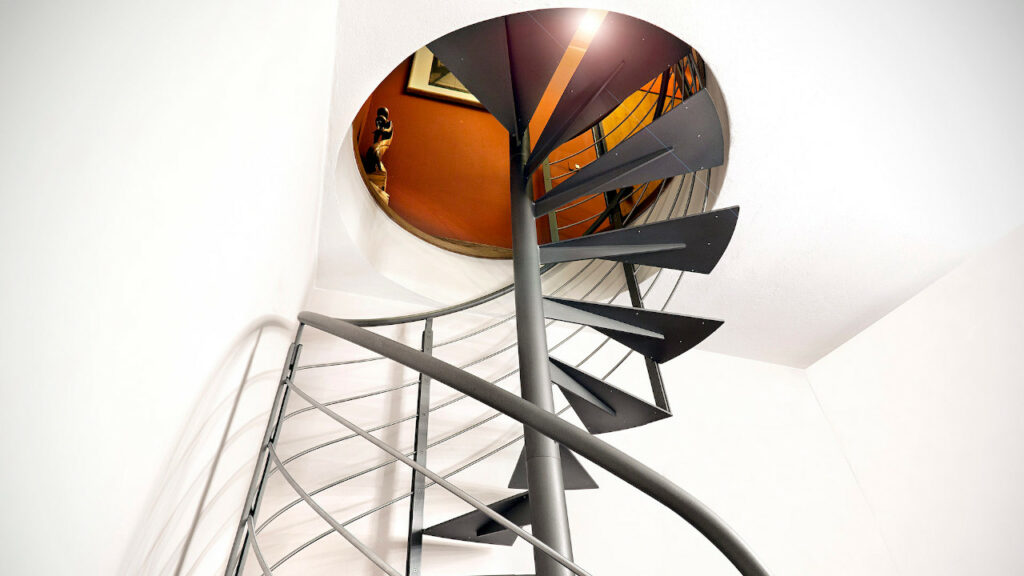 Explore the theme of the metal spiral staircase