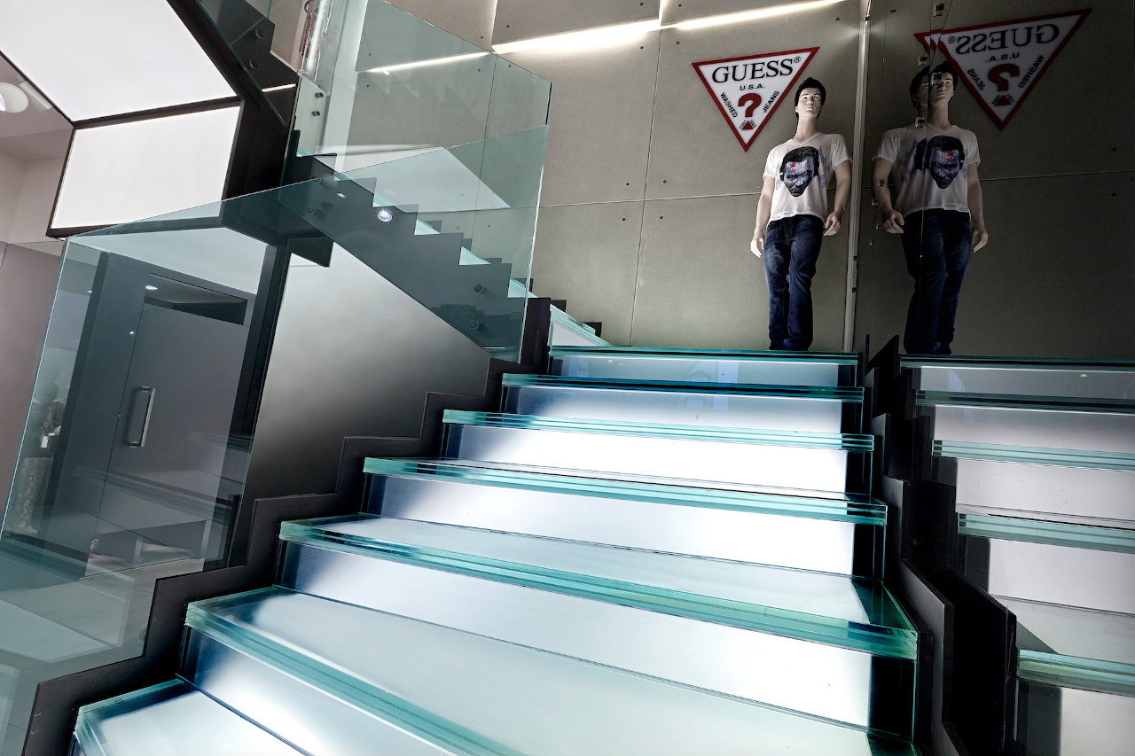 Current Interior Stairs: not only oak stair cladding but also amazing glass stair cladding -Guess Shop in Rome city-